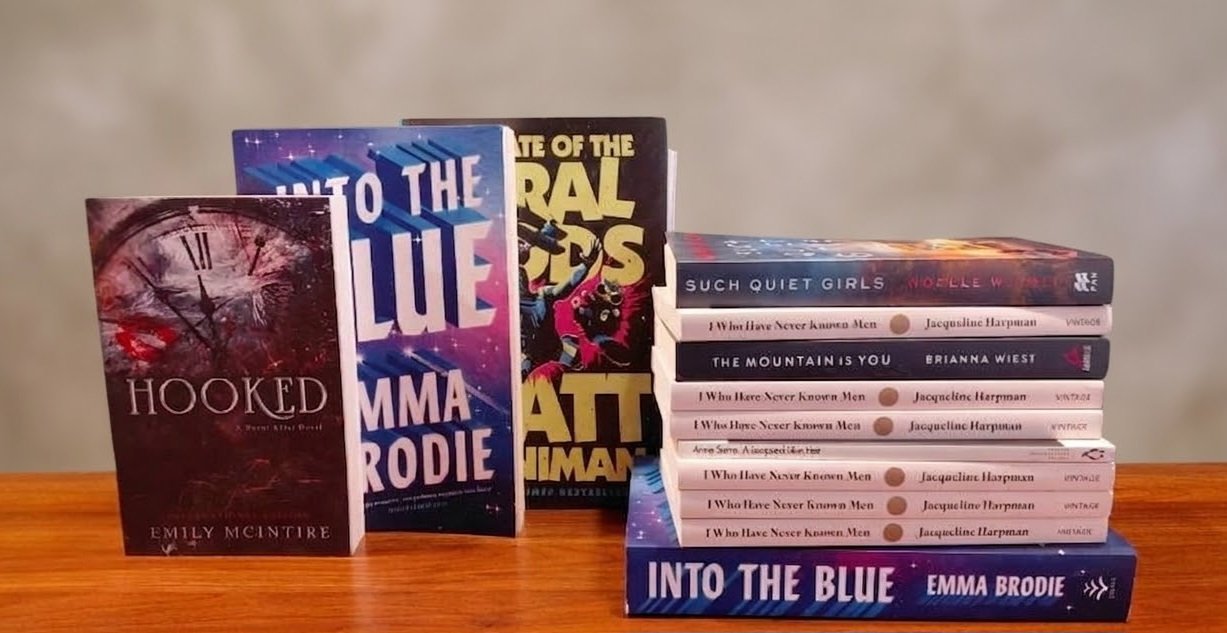 A stack of books with different titles